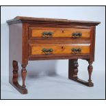 An early 20th Century apprentice piece style mahogany chest of drawers, flared gallery top with