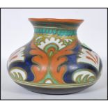 A 20th Century Gouda pottery vase of squat form in the Ali pattern. Signed to the base 6Y ALi,