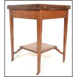 An early 20th Century Edwardian mahogany envelope card table, the top swivelling round to reveal