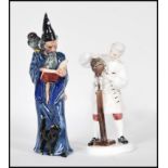 Two Royal Doulton bone China figurines to include The Wizard  HN 2877 and The Wig Maker of
