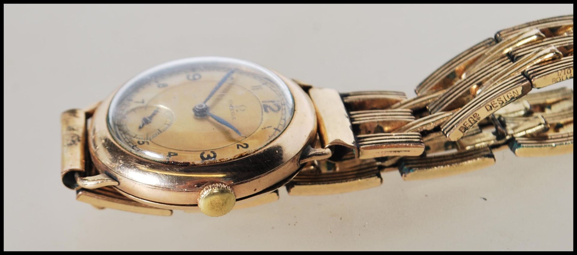 A vintage 1930's 15 jewels Omega gentleman's gold plated wrist watch having a round gilt face with - Bild 3 aus 7