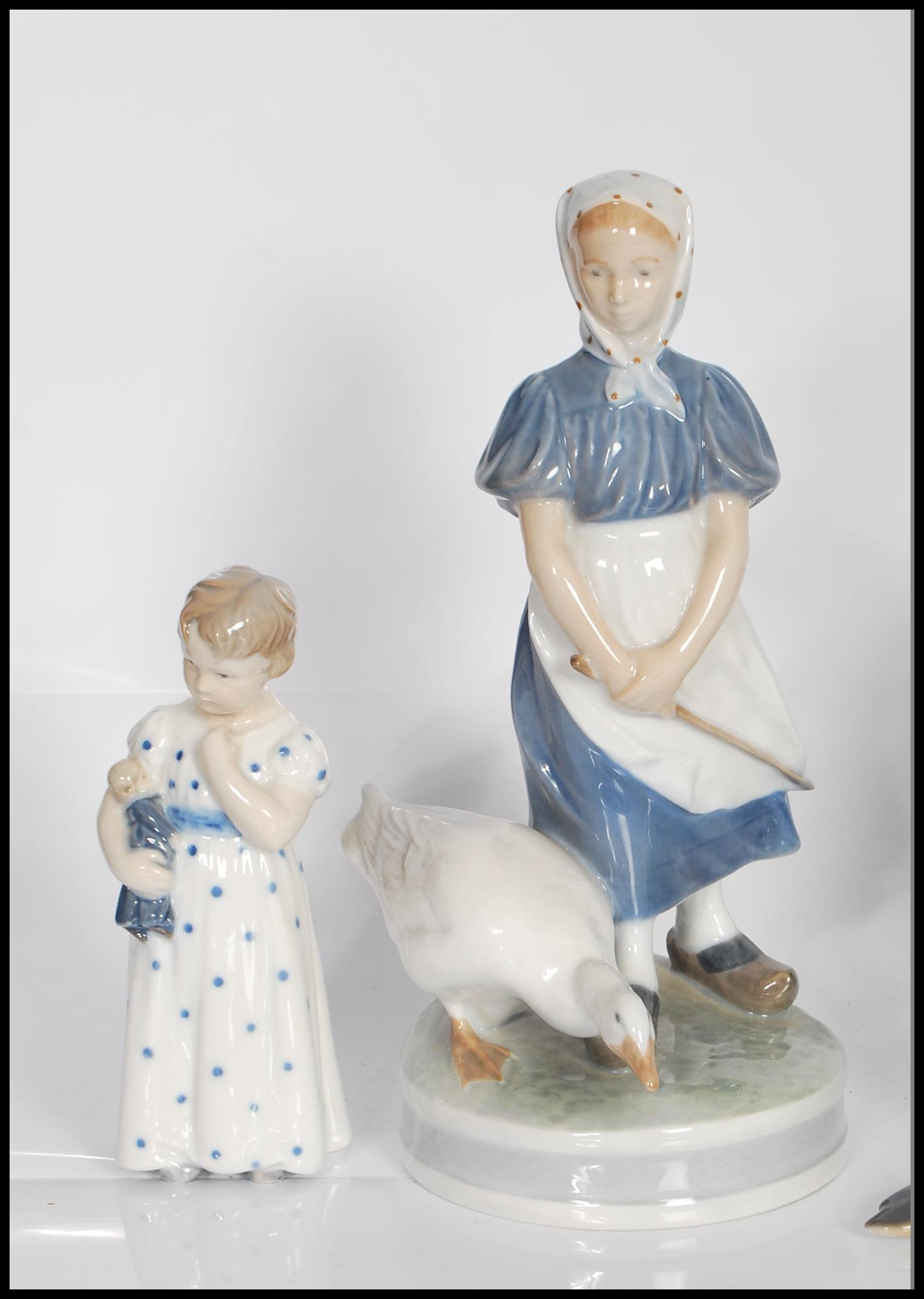 A collection of Royal Copenhagen figurines to include no. 1316 figure group of two milk maids, no. - Image 2 of 8