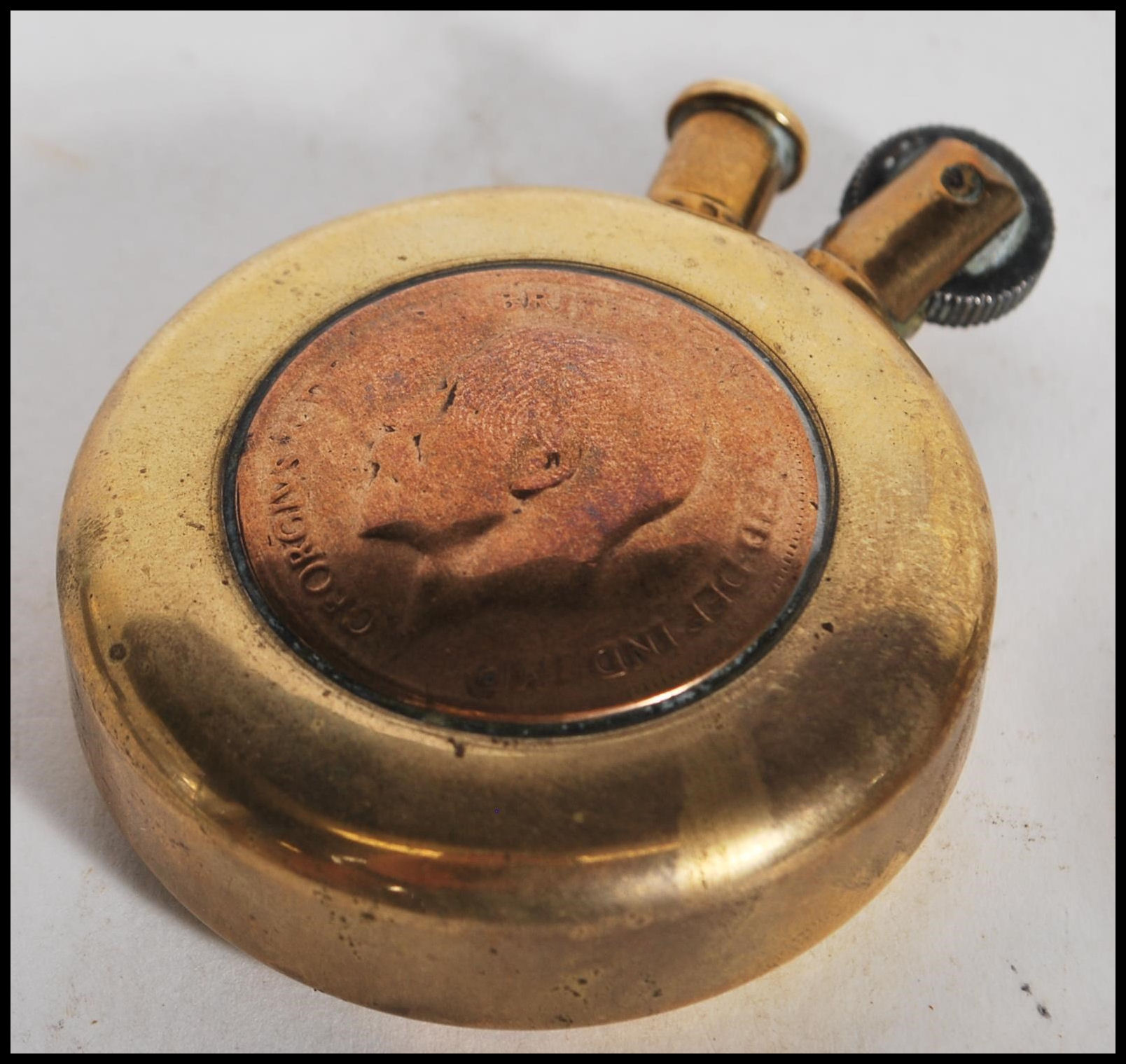 Two 20th Century military WW2 trench art brass lighters of round form one inset with a British coin, - Image 5 of 5