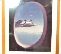 A framed and glazed photograph of a Met Office ' Snoopy ' Hercules aircraft performing a