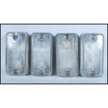 A group of four vintage retro 20th Century industrial prismatic glass bulkhead lights with metal