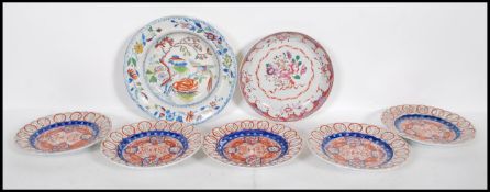 A collection of 19th Century plates to include a Chinese hand painted famille rose plate decorated