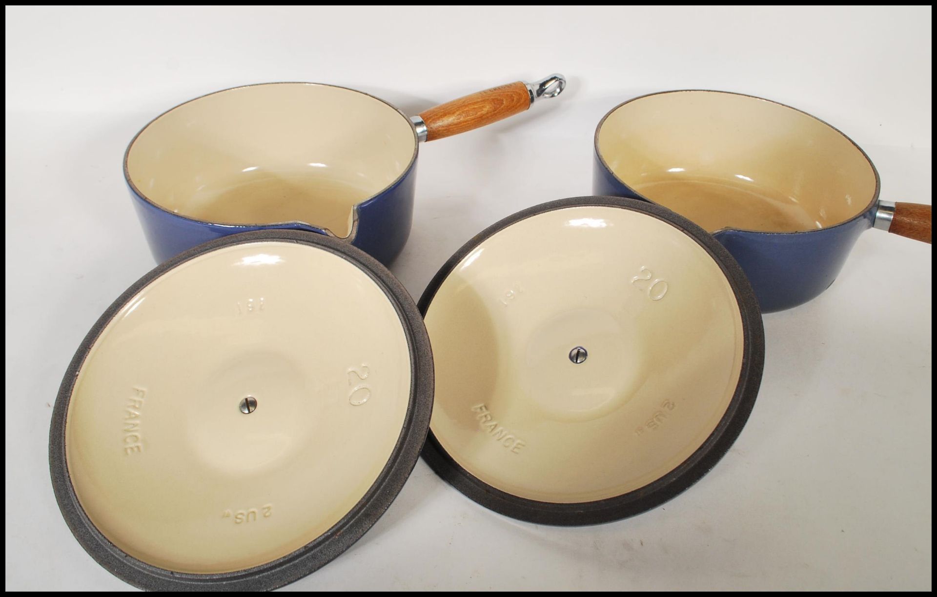 A pair of 20th Century Le Creuset lidded stove top cast iron sauce pans, each fitted with a turned - Image 5 of 5