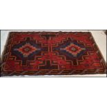 A hand knotted woolen Herati Baluchi carpet floor rug, central panel with traditional motif and