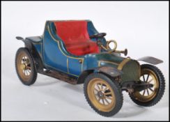 A mid 20th Century wood and metal table lighter in the form of a classic car finished in blue with