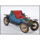 A mid 20th Century wood and metal table lighter in the form of a classic car finished in blue with