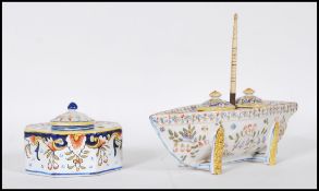 A 20th Century continental enamelled ink well in the form of a boat having two removable lidded
