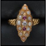 A 9ct gold seed pearl, ruby and diamond ring in lo