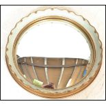 A mid 20th Century Regency revival  circular convex fisheye wall mirror, gilt frame having a