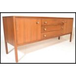 A vintage retro 20th Century teak wood Danish sideboard credenza, flared top over a central bank