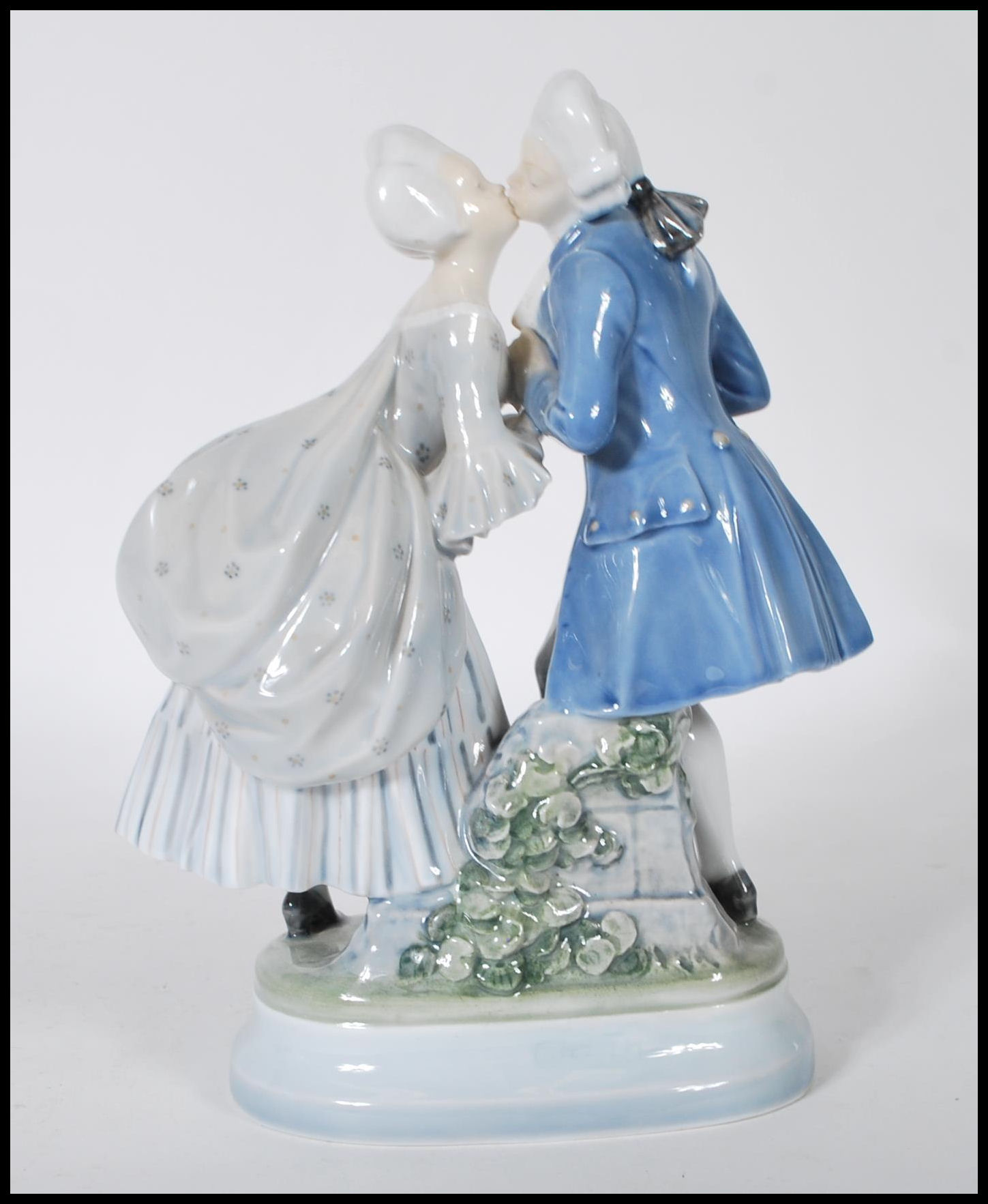 A Royal Copenhagen porcelain figurine depicting a Georgian couple kissing on a plinth base. Marks to - Image 3 of 6