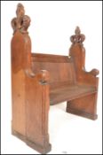A 19th Century Victorian oak ecclesiastical church pew, panel back with solid seat flanked by