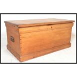 A 19th Century Victorian pine blanket box chest, hinged top with open storage, carry handles to