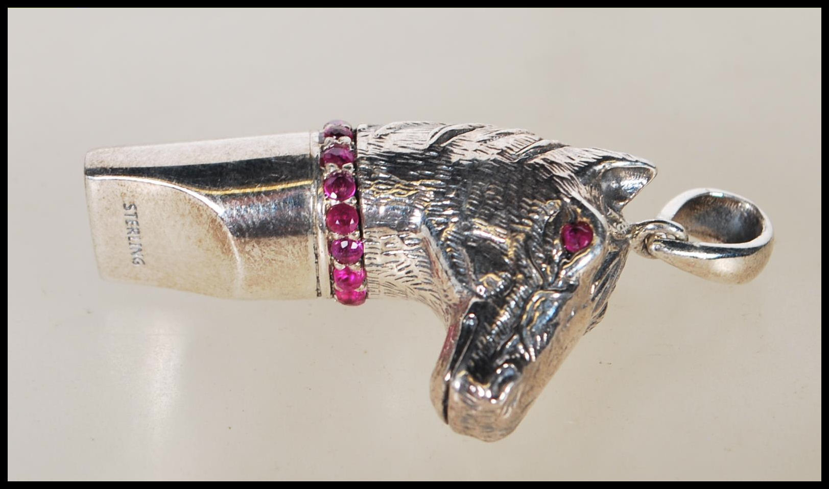 A silver novelty whistle pendant in the form of a horse head set with ruby eyes and having a ruby - Image 5 of 6