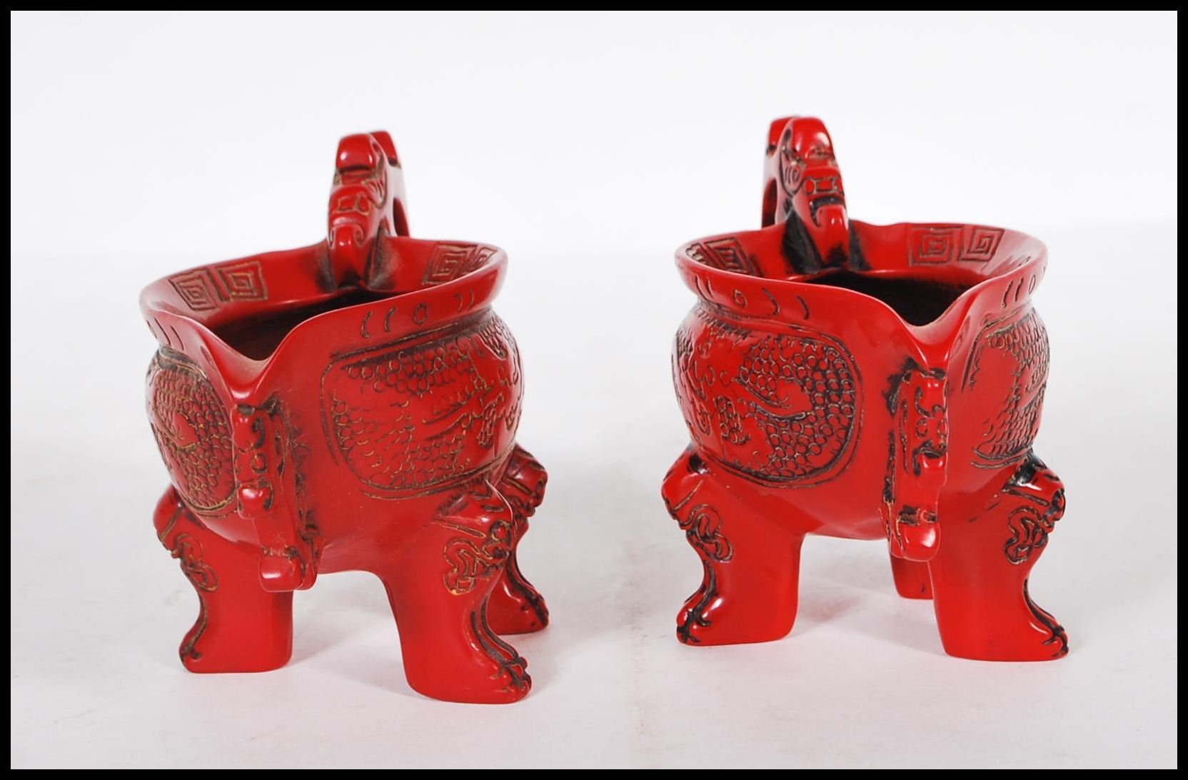 A pair of 20th Century Chinese faux Cinnabar lacquer oil pourers having scrolled decoration with - Image 2 of 6