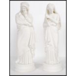 A pair of 20th Century ceramic blanc de chine classical figurines of two of the Greek muses,