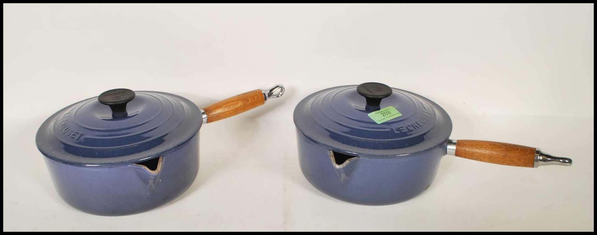 A pair of 20th Century Le Creuset lidded stove top cast iron sauce pans, each fitted with a turned - Image 2 of 5