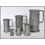 A set of six graduating 18th / 19th Century French apothecary pewter measuring cups. Each measure