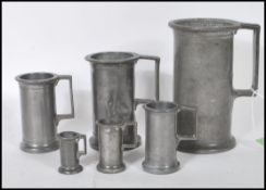 A set of six graduating 18th / 19th Century French apothecary pewter measuring cups. Each measure