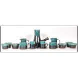 A vintage Woburn studio pottery coffee set having green mottled turquoise glaze rims to include