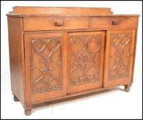 A late 19th Century Victorian oak sideboard credenza in the manner of A.W.N. Pugin, gallery back