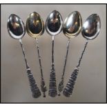 A set of five silver hallmarked Chinese silver teaspoons, each having Chinese characters