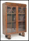 A first half of the 20th Century oak twin glazed door china display cabinet adjustable shelves to