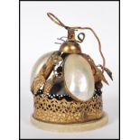 A turn of the Century high Victorian evening dinner bell having three mother of pearl shells with