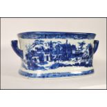 A large 20th Century reproduction stoneware blue and white Victorian style printed twin handled