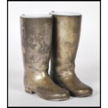 PAIR OF SILVER PLATED DRINKS MEASURES IN THE FORM OF BOOTS