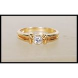 A stamped 18ct yellow gold solitaire diamond ring of approx 20pts. Stamped 750. Ring size K. Gross