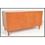 A retro 20th Century teak wood blanket box chest, hinged top raised on stub supports.  Measures: