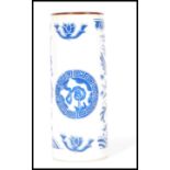 A early 20th Century Chinese blue and white brush pot decorated with a phoenix and dragon having