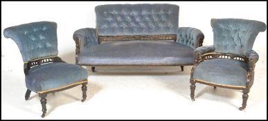 A Victorian aesthetic movement ebonised with gilt decoration lounge suite of a two seater sofa