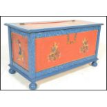 A 20th Century Swiss style painted pine coffer chest, each panel decorated with different scenes,