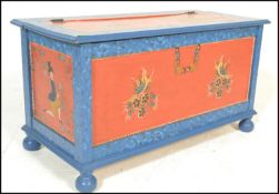 A 20th Century Swiss style painted pine coffer chest, each panel decorated with different scenes,