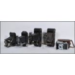 A collection of vintage 20th Century fold out cameras to include Kodak Six-20 Junior deluxe, Kodak