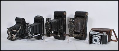 A collection of vintage 20th Century fold out cameras to include Kodak Six-20 Junior deluxe, Kodak