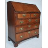 A Georgian figured walnut veneered bureau. Crossbanded, with fully appointed interior,  over two