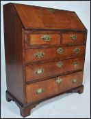A Georgian figured walnut veneered bureau. Crossbanded, with fully appointed interior,  over two