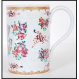 A 19th Century Edme Samson of Paris porcelain mug painted in the Chinese Armorial Export taste.