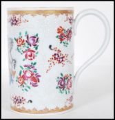 A 19th Century Edme Samson of Paris porcelain mug painted in the Chinese Armorial Export taste.