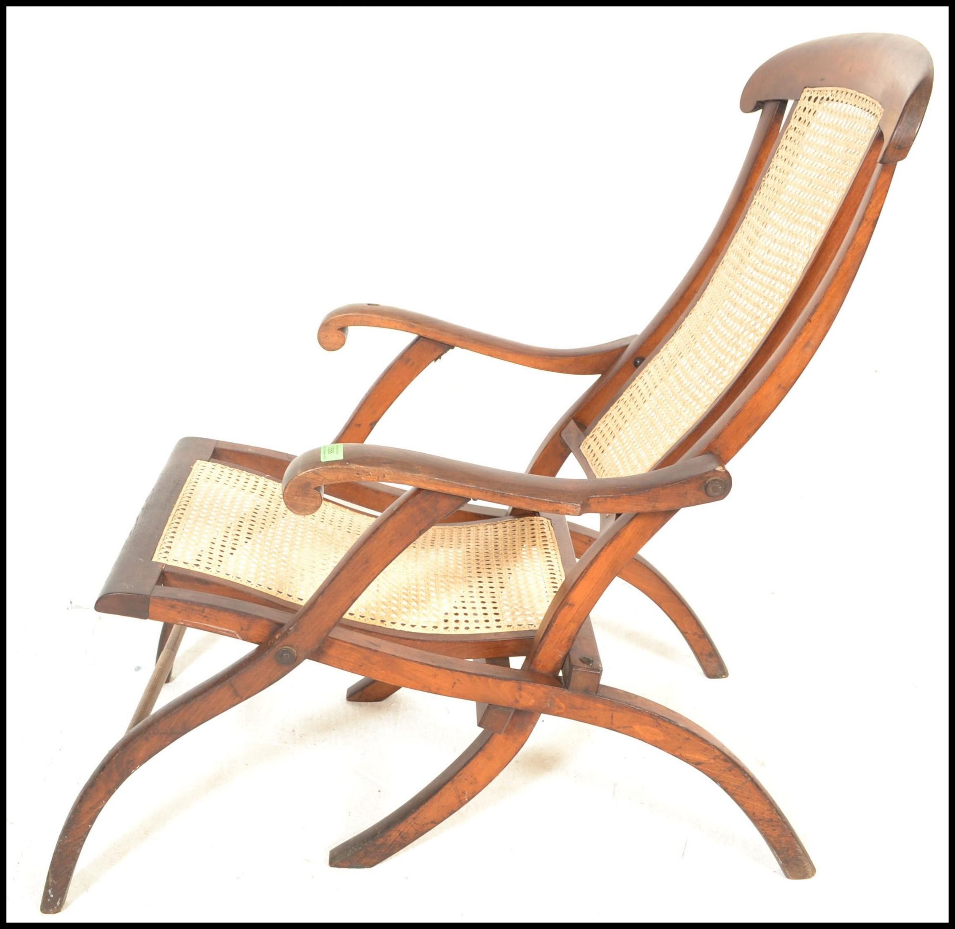 An early 20th Century campaign folding steamer chair of beech construction having caned backrest and - Image 2 of 5