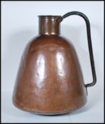 A late 19th / early 20th Century Persian Islamic copper water carrier of rounded tapering form