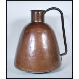 A late 19th / early 20th Century Persian Islamic copper water carrier of rounded tapering form