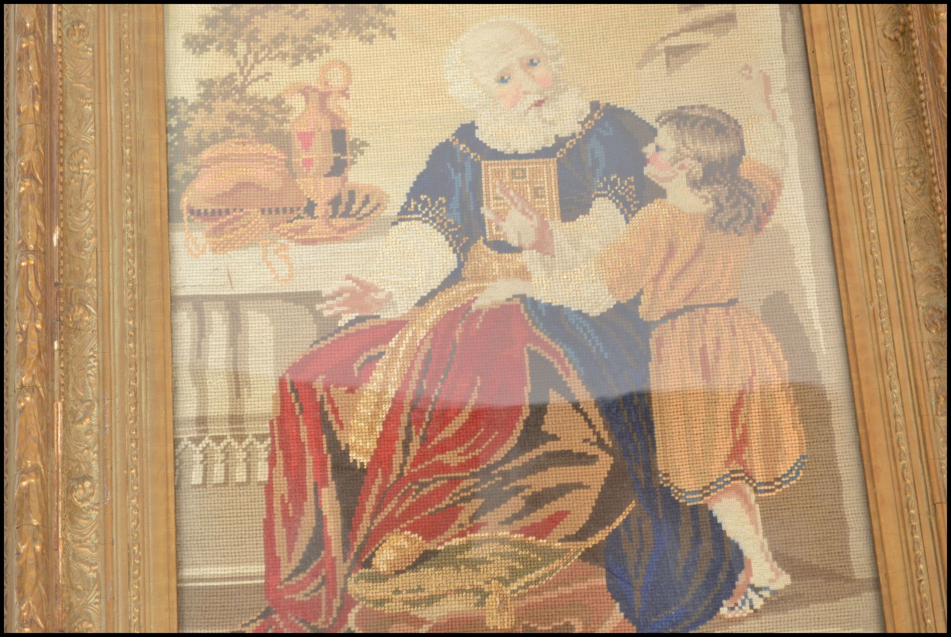A 19th Century framed and glazed needlework tapestry depicting a seated religious gentleman beside a - Bild 2 aus 5